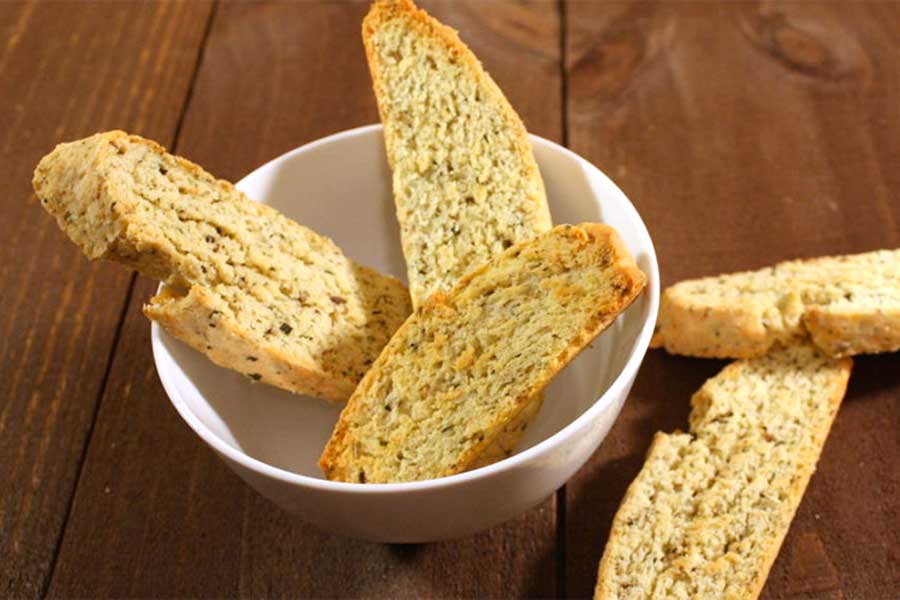 Savory Herb and Cheese Biscotti in a white bowl.