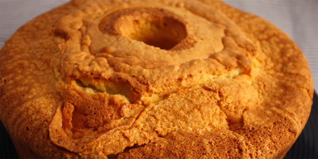 Mom's Sour Cream Pound Cake - Moist, tender inside with a crispy crunchy crust. A classic at it's best! Sour Cream Pound Cake on a black plate.