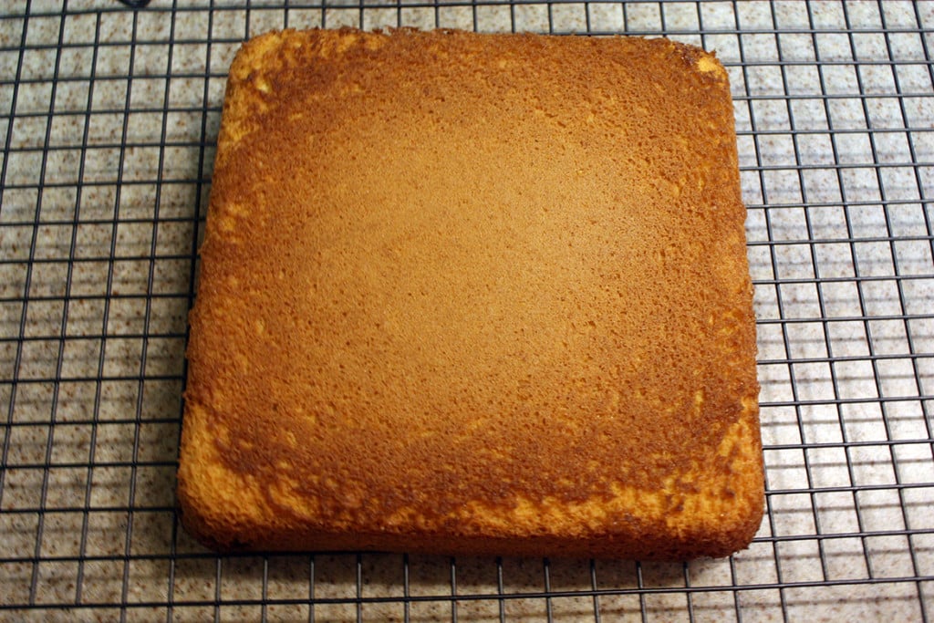 Genoise cake on a wire rack.