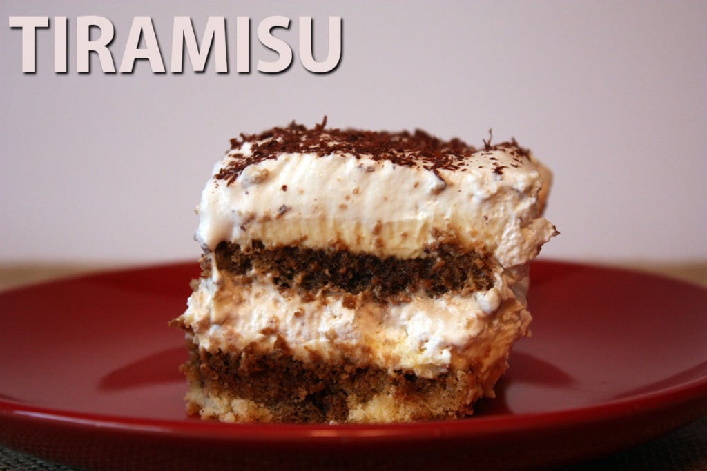 A slice of tiramisu on a red plate.