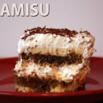 A slice of tiramisu on a red plate.