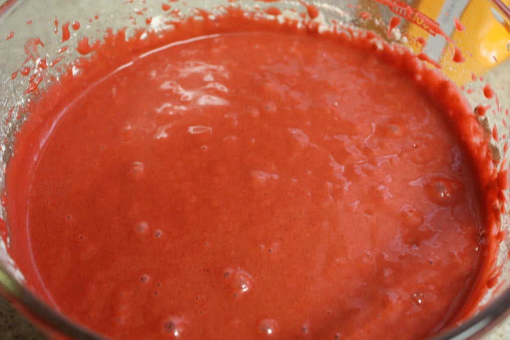 Red velvet cupcakes batter in a glass bowl.