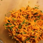 Savory Carrot Salad on a cutting board.