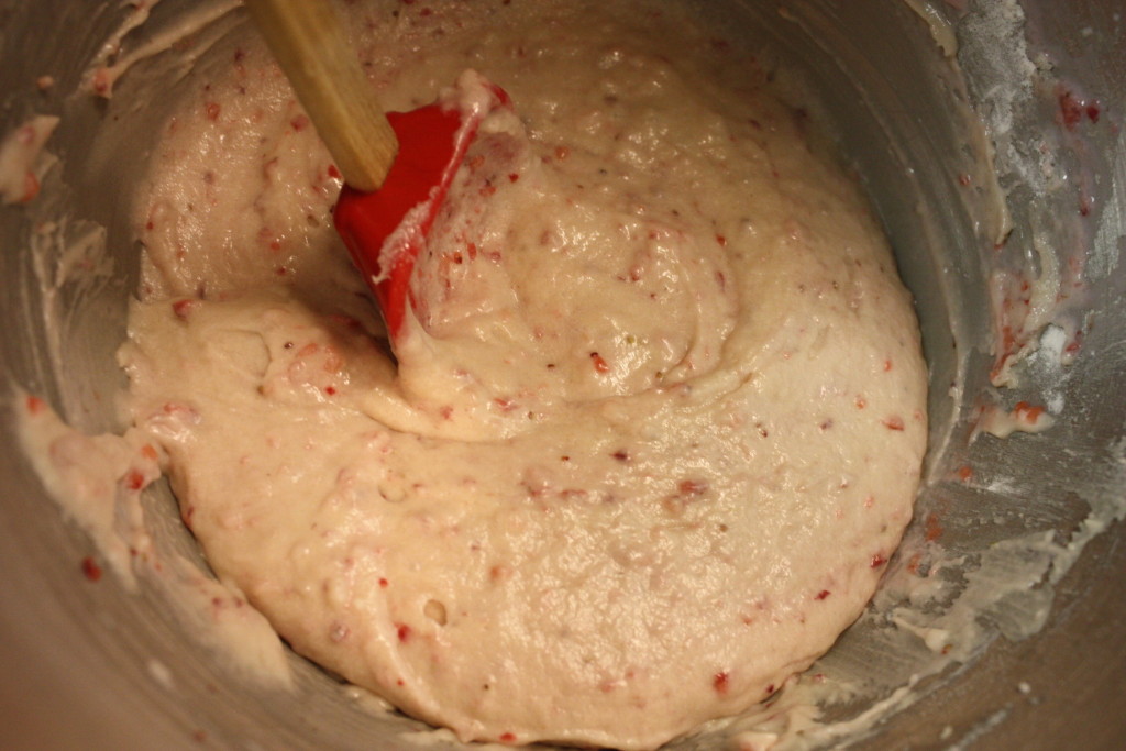 Cupcake batter in a metal mixing bowl.