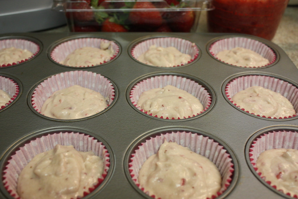 Cupcake batter divided among cupcake liners.