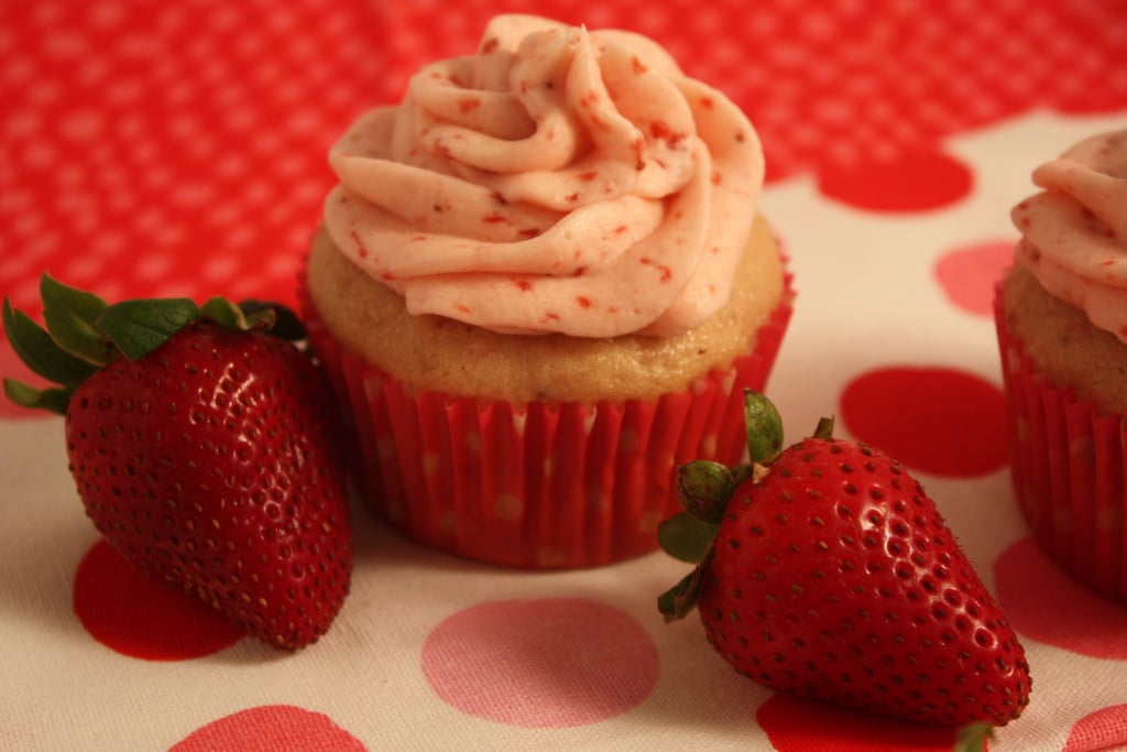 Fresh Strawberry Cupcakes on a red polka dot tablecloth.