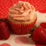 Fresh Strawberry Cupcakes on a red polka dot tablecloth.