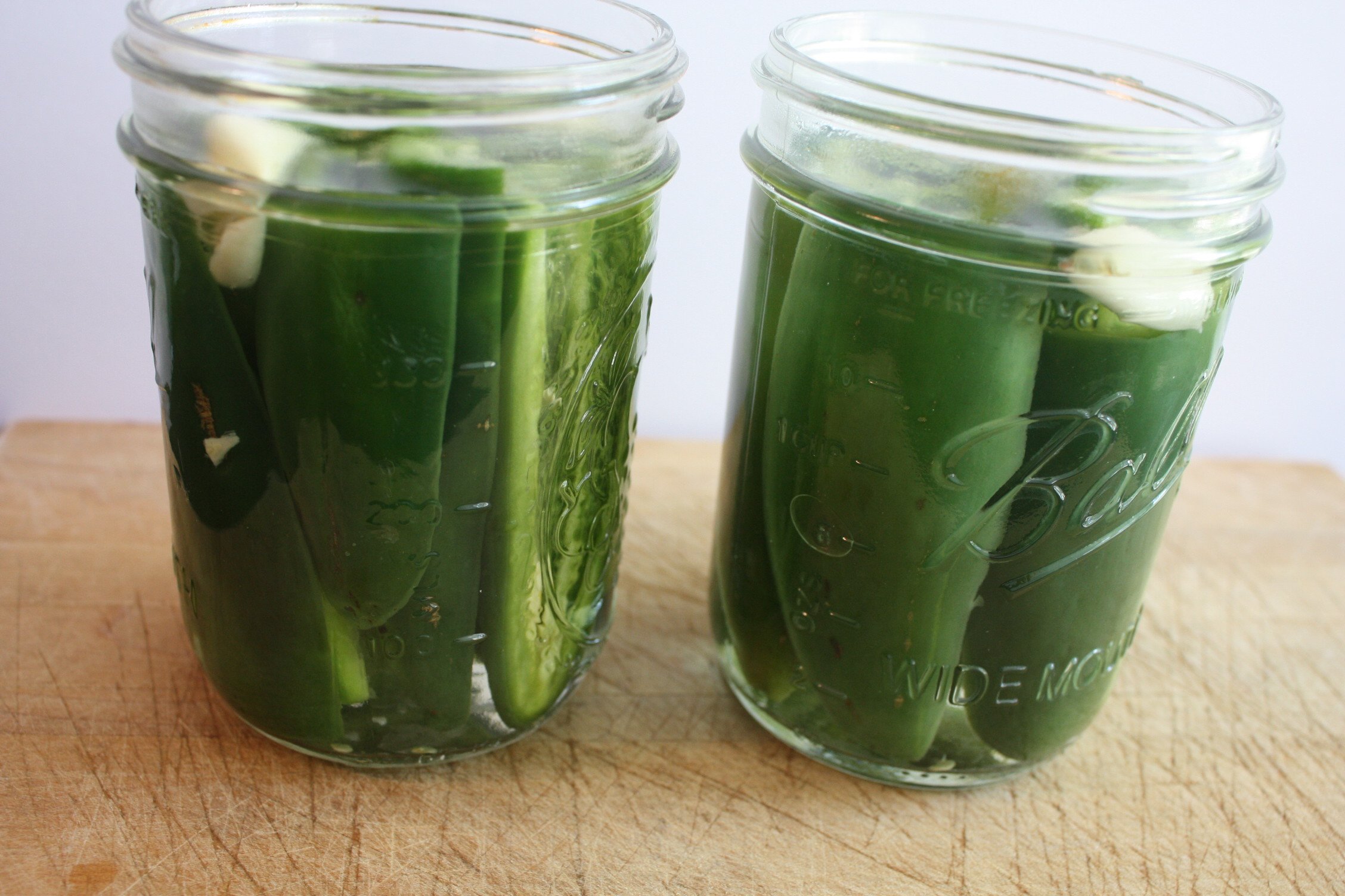 Pickled jalapeno peppers in mason jars.