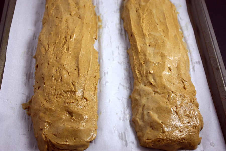 pumpkin biscotti dough formed on parchment paper