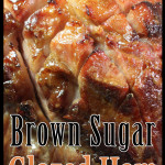 Brown sugar glazed ham in a roasting pan.