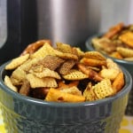 Slow Cooker Chex Mix in a blue serving bowl.