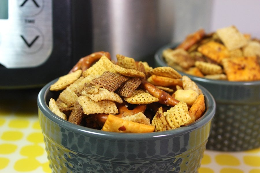 Slow Cooker Chex Mix in a blue serve bowl.
