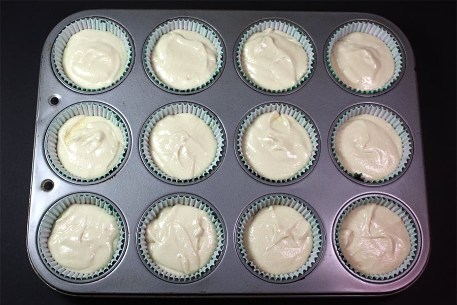 Coconut Cupcakes batter divided into a muffin tin
