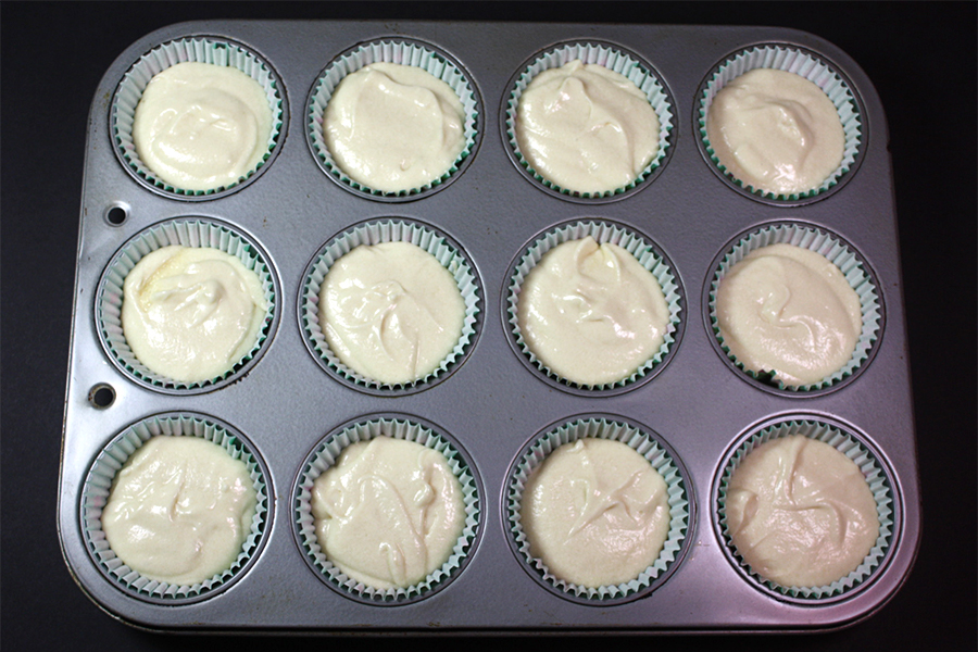 Coconut Cupcakes batter divided into a muffin tin