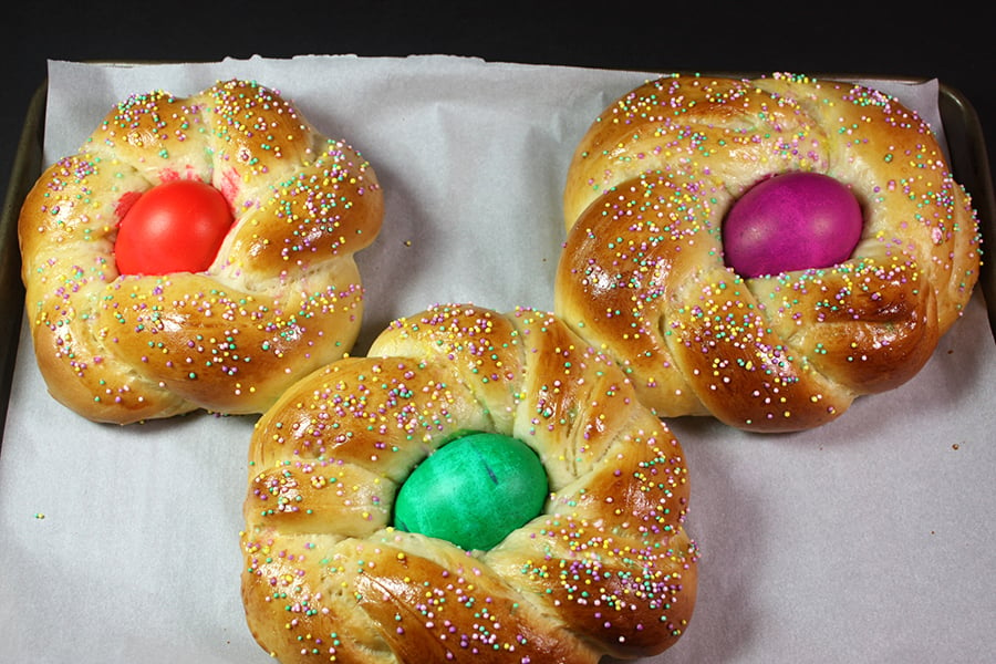 Italian Easter Bread on a parchment lined baking sheet.