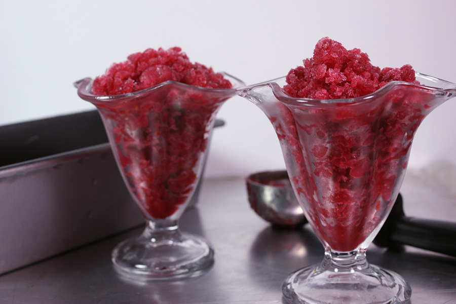 Blood Orange Granitas in sorbet glasses on a metal sheet pan