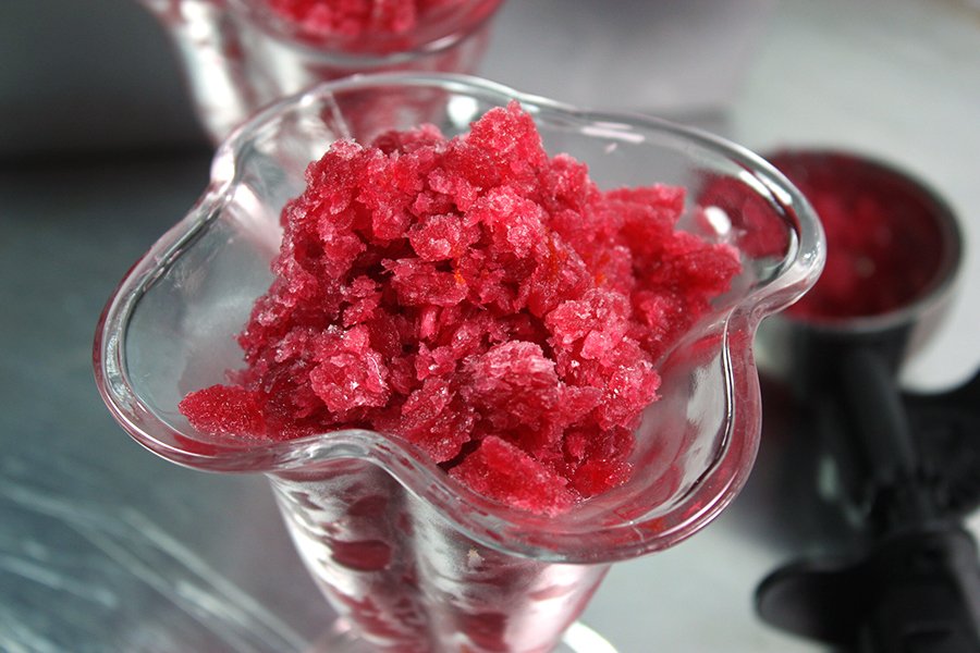 Blood Orange Granita in a glass ice cream serving dish.