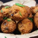 Jalapeno Hushpuppies stacked up in a basket.