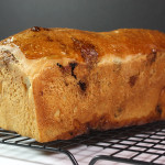 Loaves of cinnamon bread cooling on a wire rack.