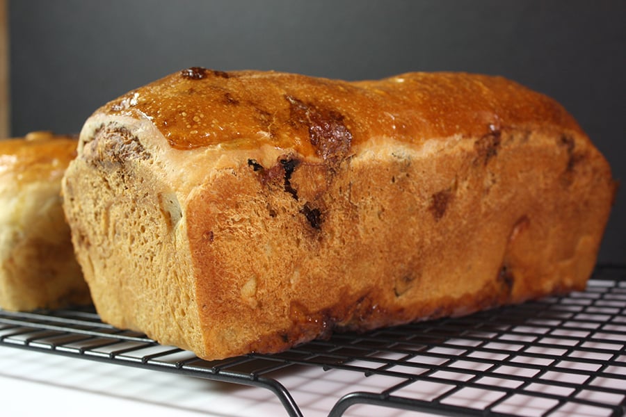 Cinnamon Raisin Bread cooling on a wire rack.