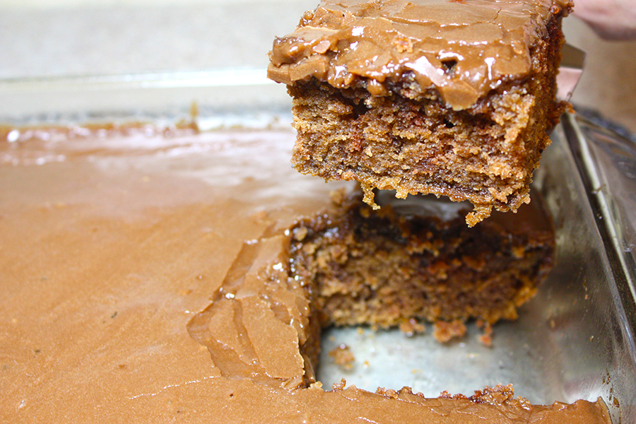 A slice of chocolate cake on a spatula.