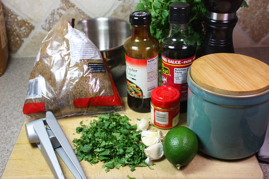 ingredients for the Turmeric Chicken Kabobs on a wooden cutting board