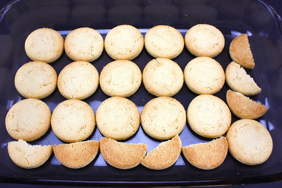 Shortbread cookies in the bottom of a glass baking dish.