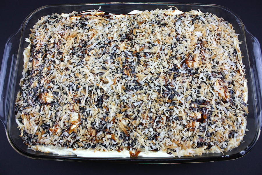 Samoa Cake in a glass baking dish.