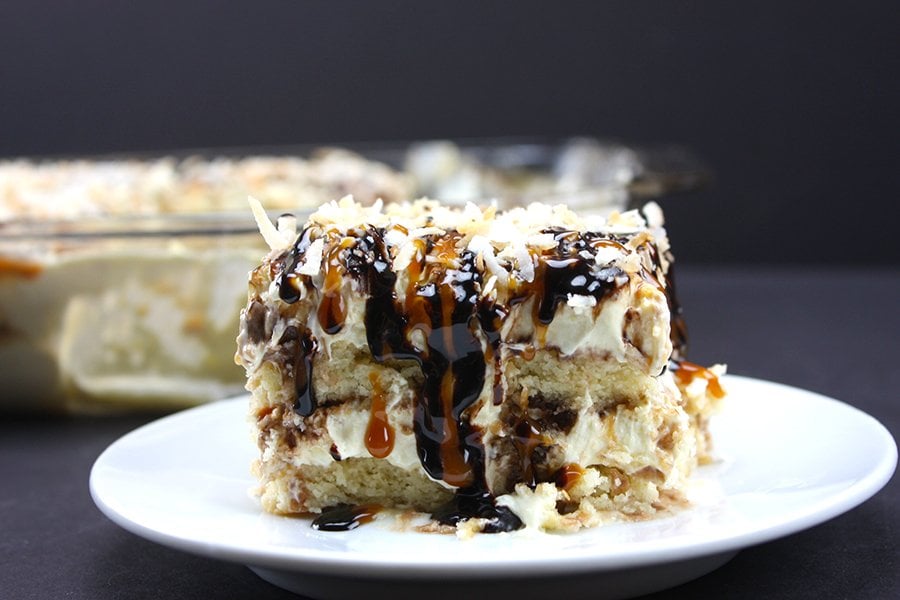 A slice of No Bake Samoa Cake on a white plate.