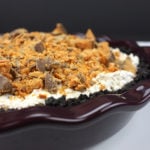 Butterfinger pie in a brown baking dish.