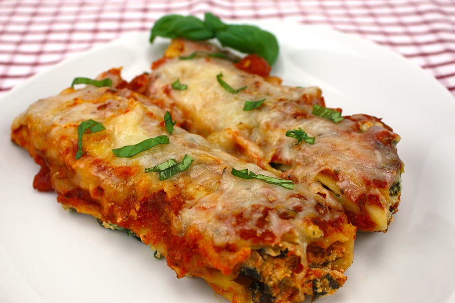 Slow Cooker Manicotti served on a white plate.