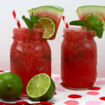 Watermelon Mojitos served in large mason jars.