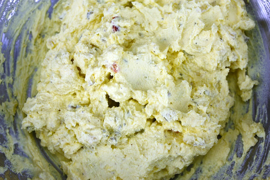 Yolk mixture in a metal bowl.