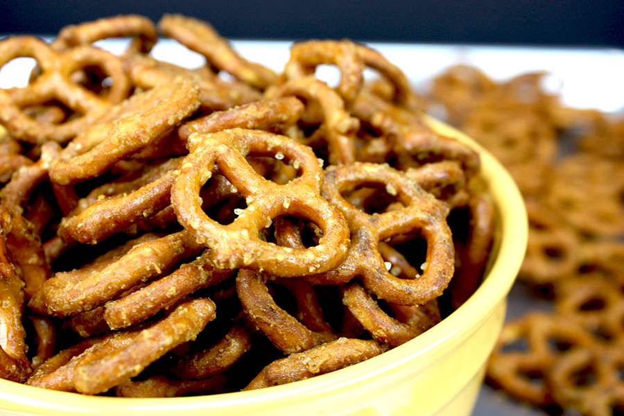 Honey mustard pretzels in a yellow bowl.