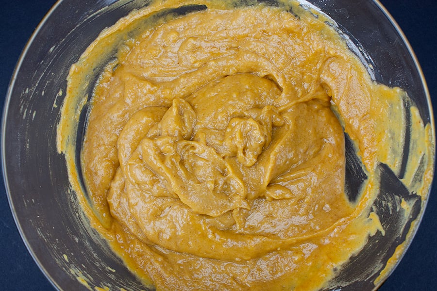 Bakery Style Pumpkin Muffins batter in a glass mixing bowl