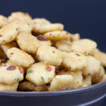 Spicy Seasoned Oyster Crackers in a dark serving bowl.