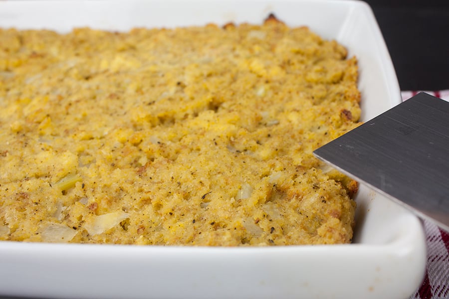 Southern cornbread dressing in a white casserole dish.