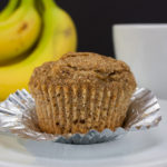 Healthy Whole Wheat Banana Muffin with the cupcake wrapper peeled down.