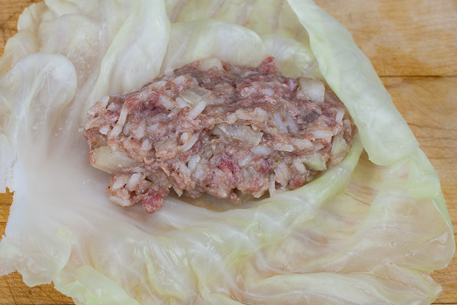 Easy Stuffed Cabbage Rolls - beef mixture placed inside a cabbage leaf