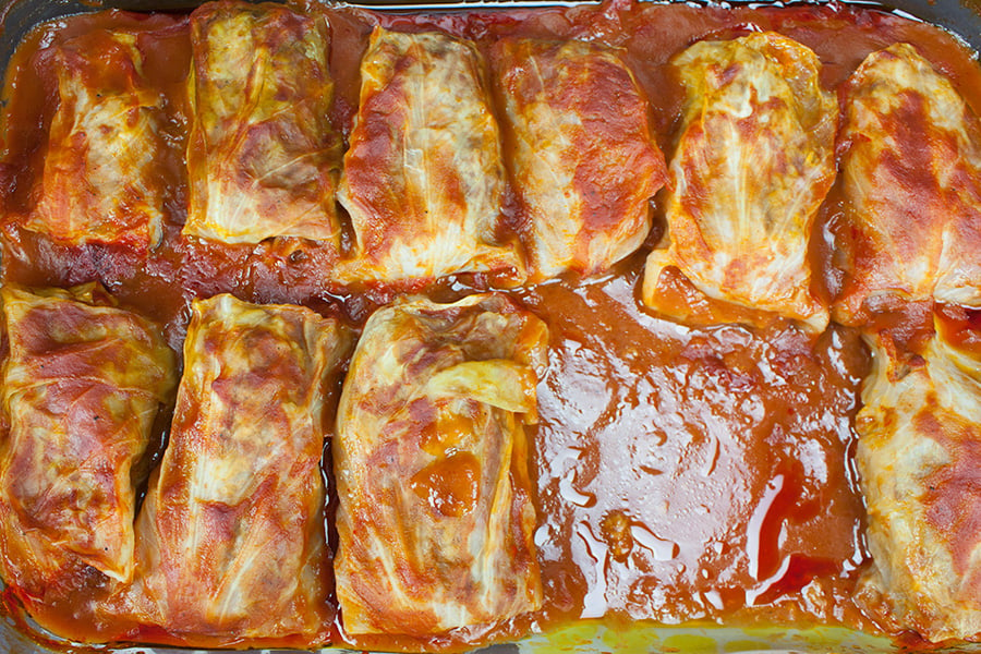 baked Cabbage Rolls in a glass baking dish