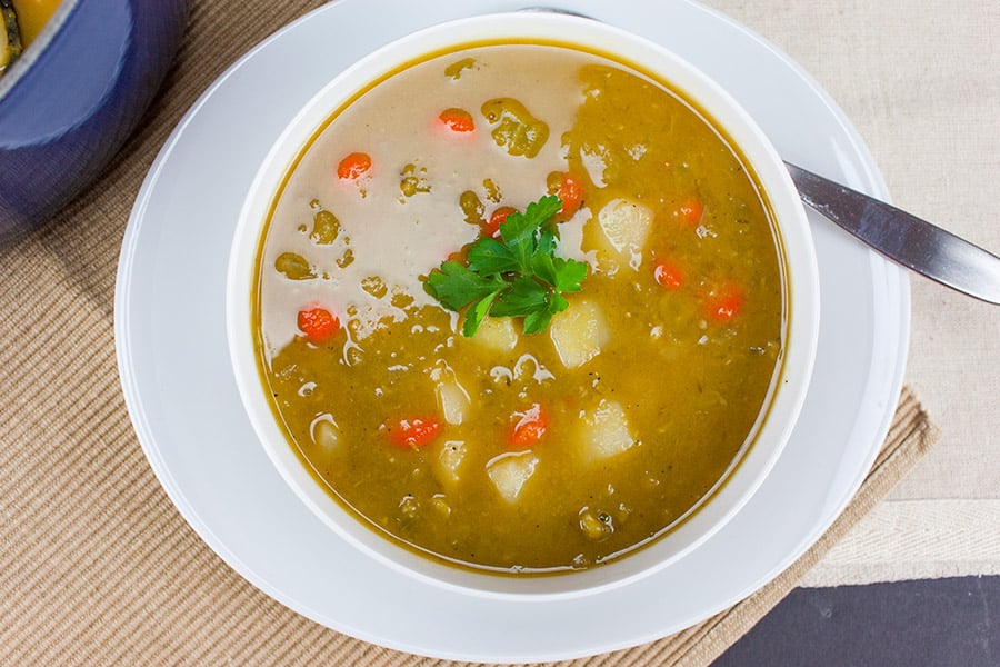 Split pea soup in a white bowl.