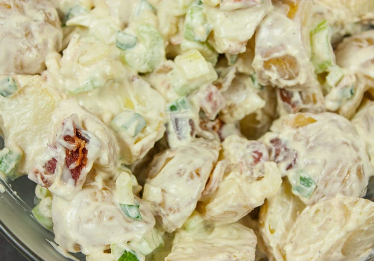 Easy Bacon Potato Salad - A great side dish for your bbq's and picnics. Creamy, tangy and loaded with bacon!