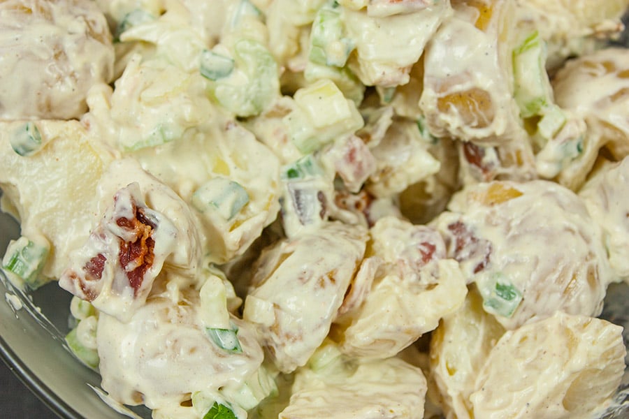 Easy Bacon Potato Salad - A great side dish for your bbq's and picnics. Creamy, tangy and loaded with bacon!