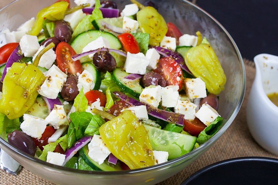 Homemade Greek Salad served in glass bowl.