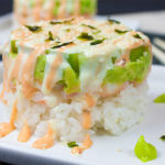 Spicy Shrimp Sushi Stack on a white plate with garnish.