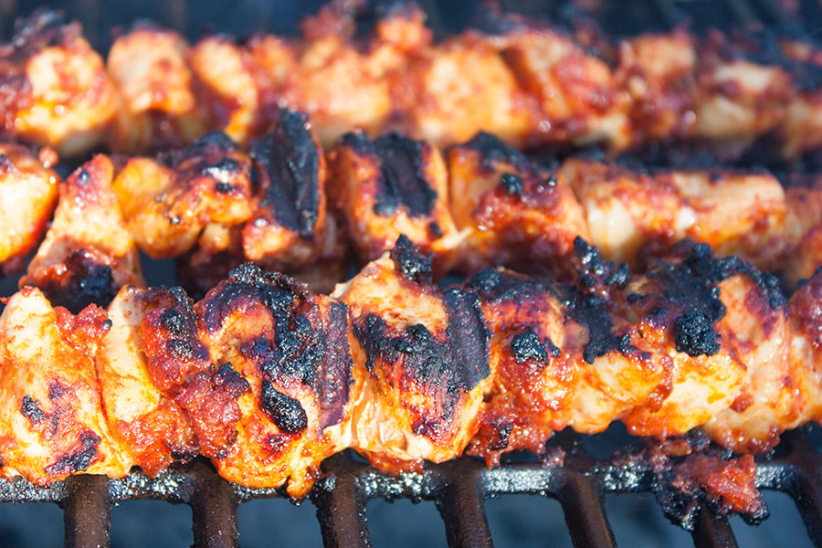 Bacon Paste BBQ Chicken Kebabs grilled on a hot grill