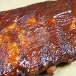 A racks of St Louis Style Ribs on a cutting board