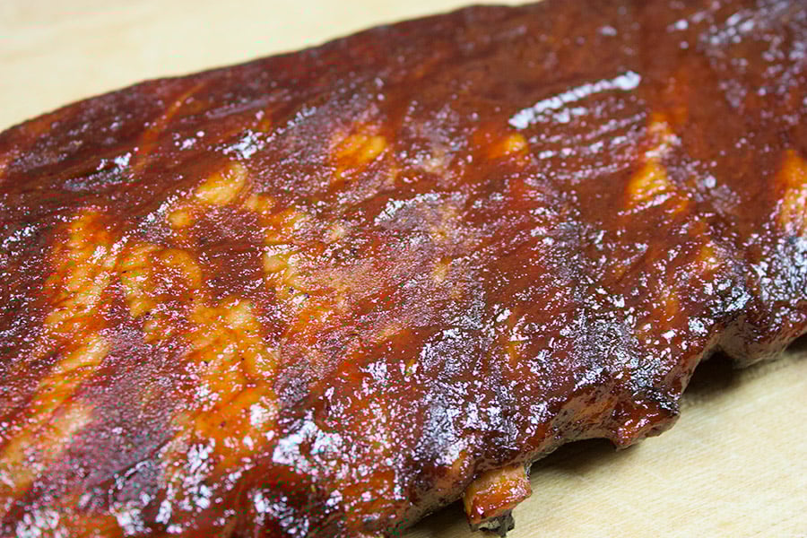 A racks of St Louis Style Ribs on a cutting board