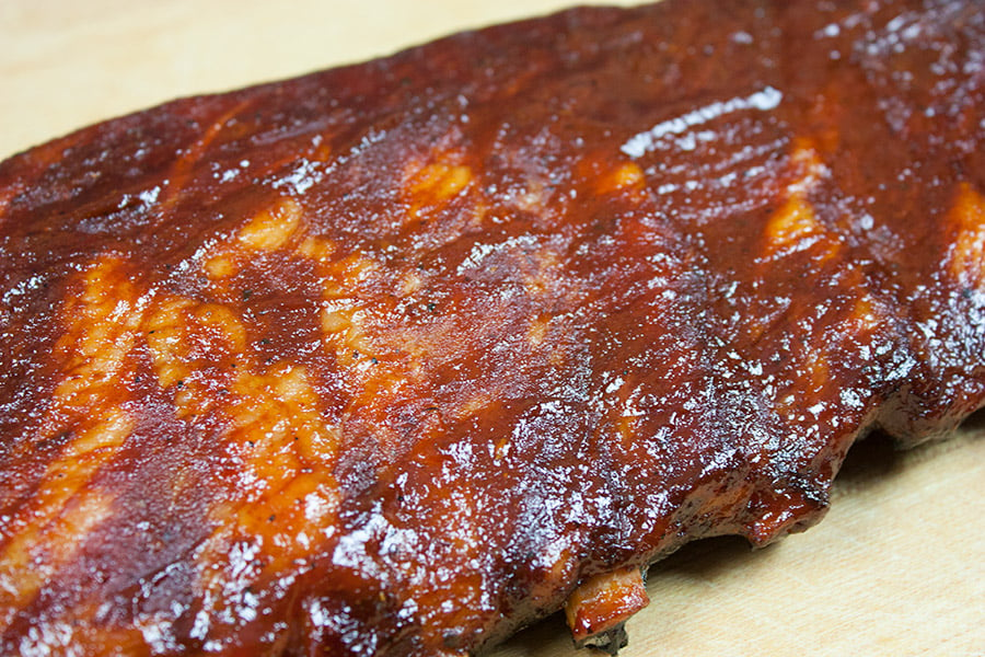 A racks of St Louis Style Ribs on a cutting board