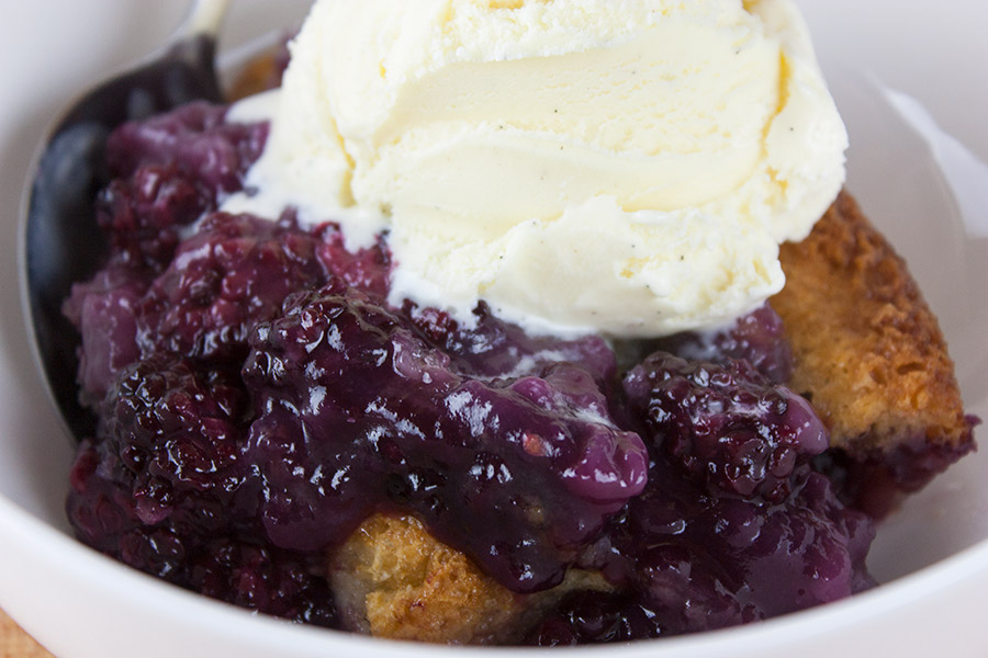 Easy Blackberry Cobbler with ice cream on top.